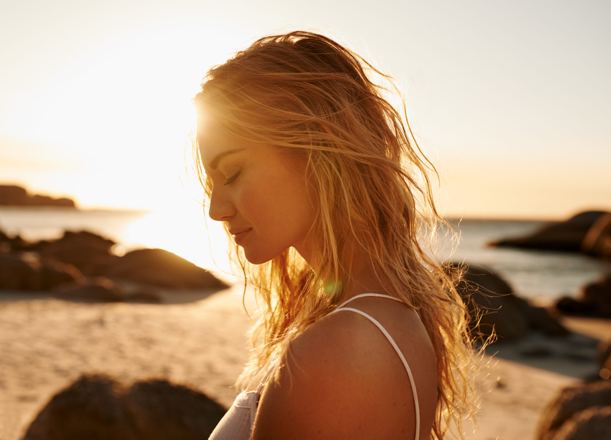 Shot of a beautiful young woman on the beach