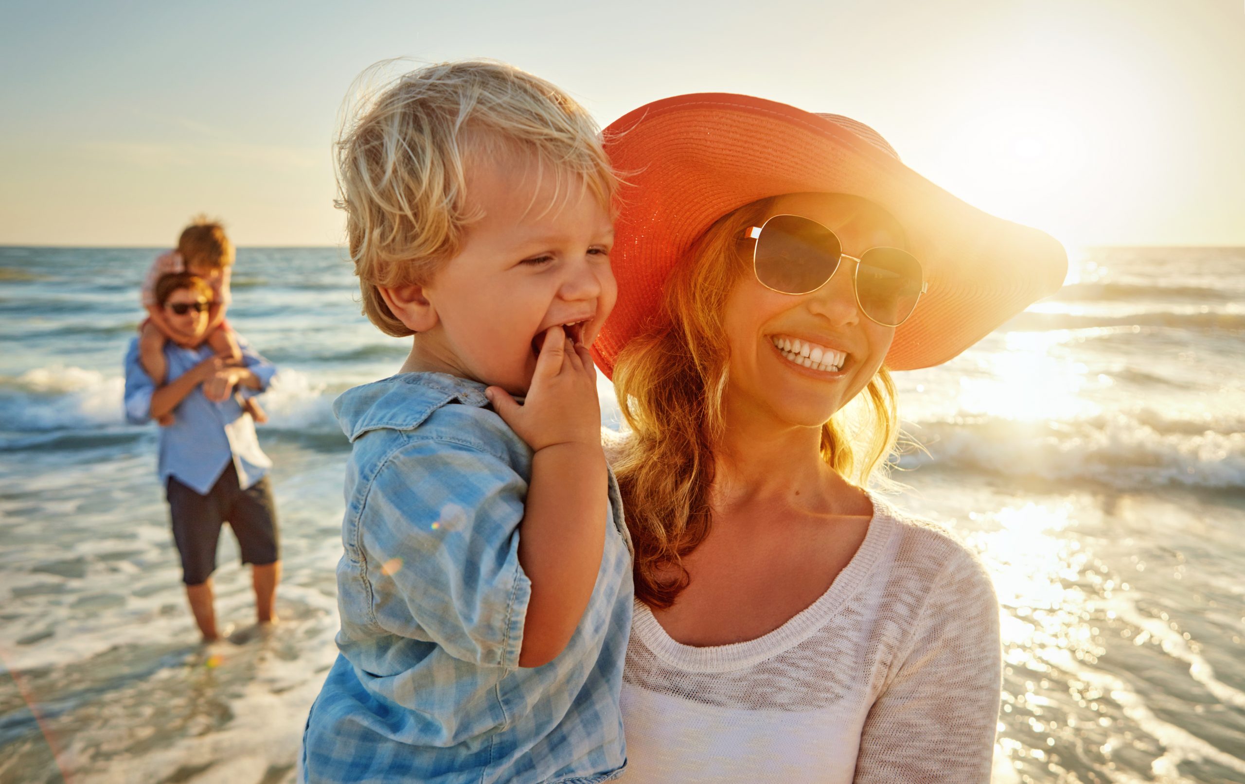 Shot of a young family enjoying a day at the beach