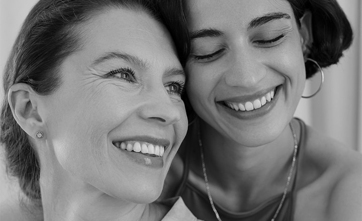 Two people smiling together