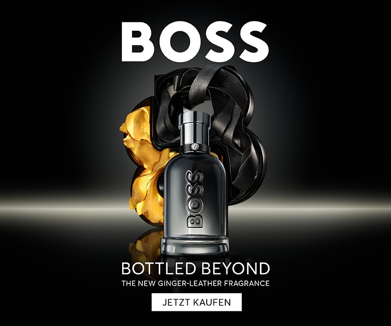 Boss Bottled Beyond: Der neue Ingwer-Leder-Duft – elegante schwarze Flasche vor luxuriösem Hintergrund in Gold und Schwarz
