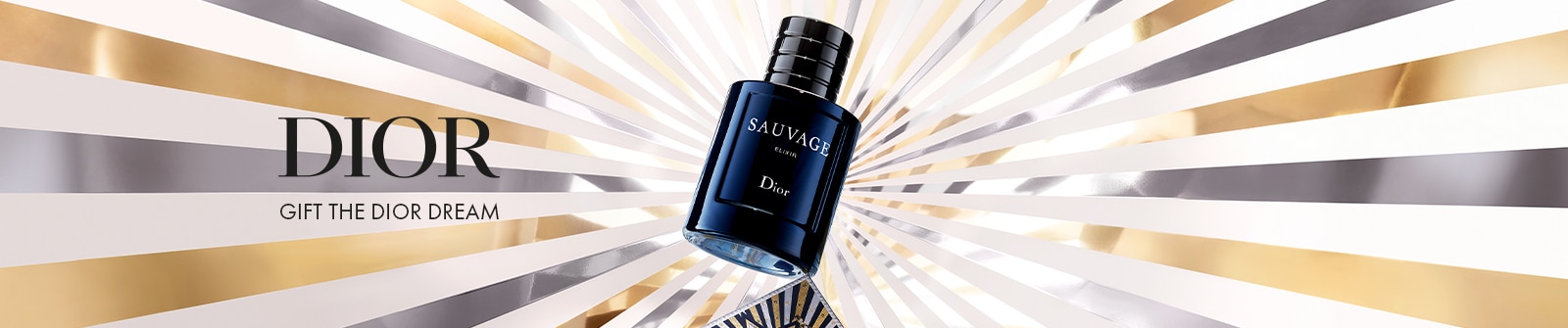 Dior: Gift the Dior Dream - Dunkelblauer Dior Sauvage Elixir-Parfümflakon, dynamisch angewinkelt vor einem strahlenden Hintergrund aus goldenen und silbernen Strahlen