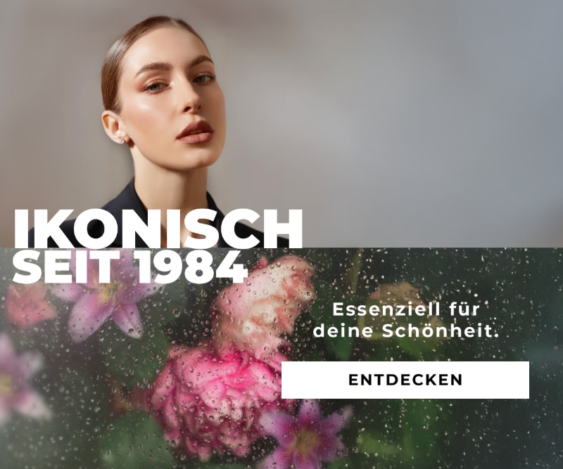 Marionnaud 1984 Kampagnenmotiv mit floralen Elementen hinter einer regennassen Scheibe und dem Text ‚Ikonisch seit 1984‘ sowie ‚Essenziell für deine Schönheit‘ mit Button ‚Entdecken‘.