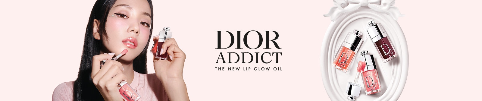 Dior Addict Lip Glow Oil Banner mit glänzenden Lippenölen in verschiedenen Farbnuancen.