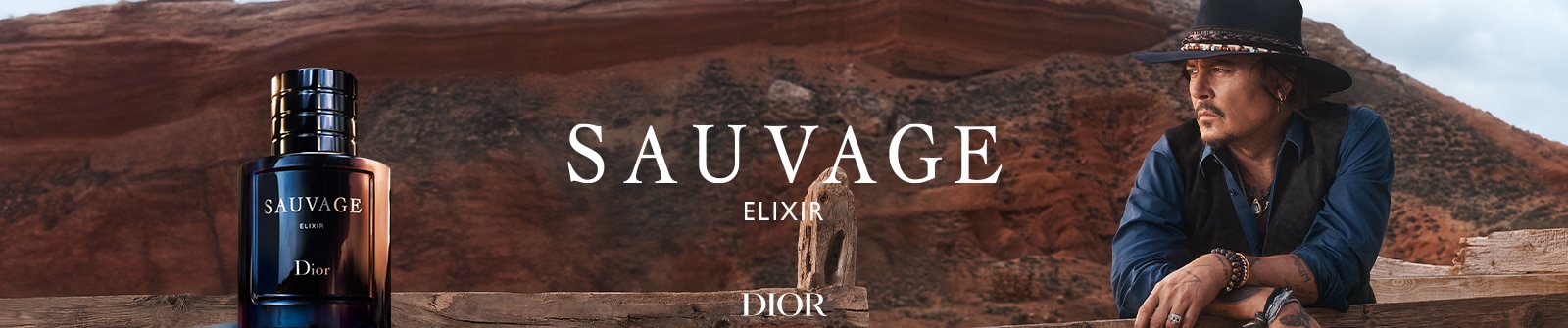 Dior Sauvage Elixir Herrenduft in dunklem Flakon vor markanter Wüstenlandschaft.